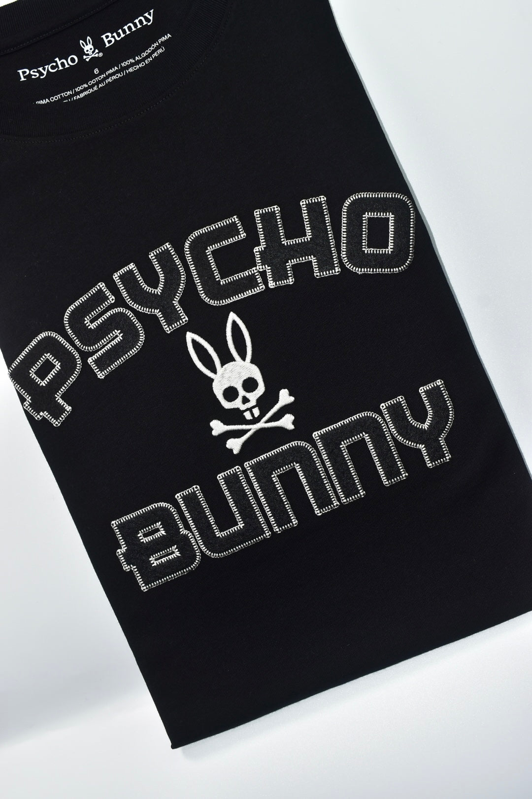 CAMISETA PSYCHO BUNNY COLECCION ORIGINAL NEGRO ESTAMPADO RELIEVE COSIDO