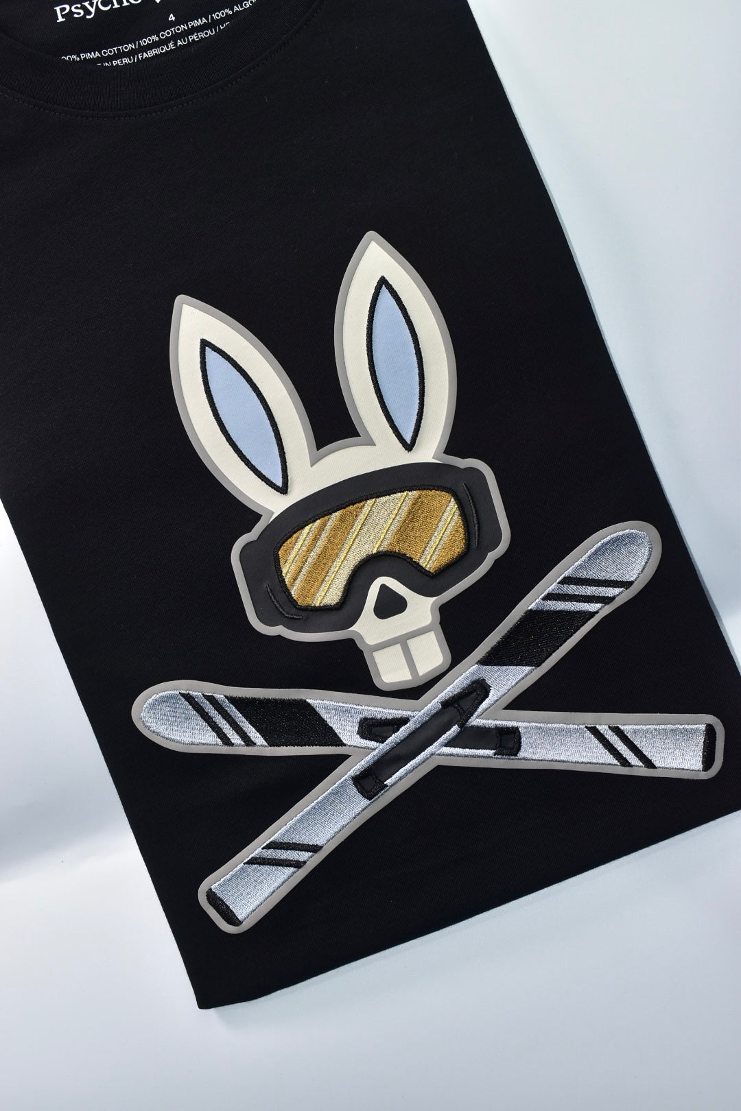 CAMISETA PSYCHO BUNNY COLECCION ORIGINAL NEGRO CONEJO BLANCO CON AZUL CLARO