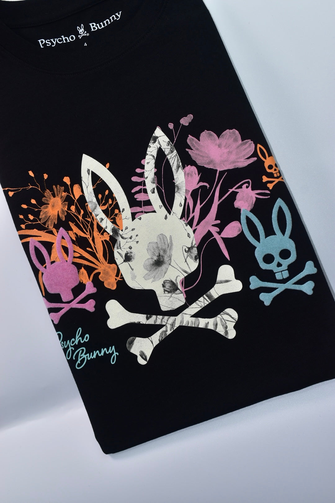 CAMISETA PSYCHO BUNNY COLECCION ORIGINAL NEGRO ESTAMPADO FLORIADO NARANJA