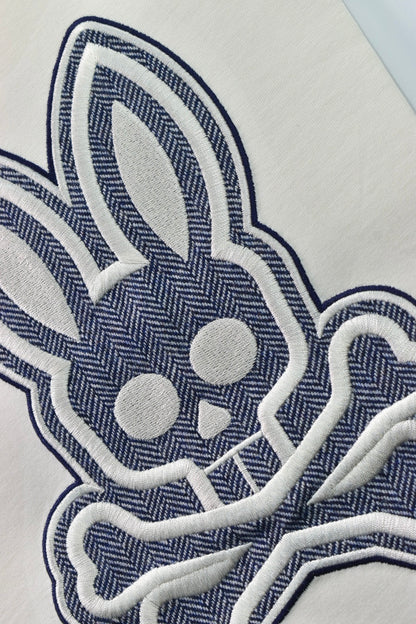 CAMISETA PSYCHO BUNNY COLECCION ORIGINAL BLANCO ESTAMPADO RAYAS AZUL BORDADO PLATA