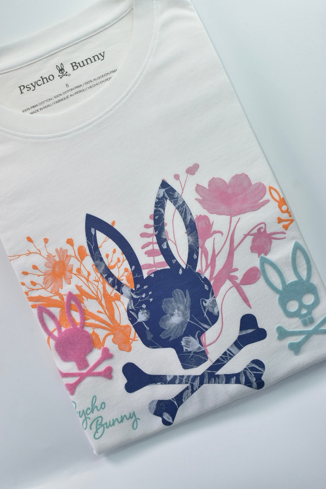 CAMISETA PSYCHO BUNNY COLECCION ORIGINAL BLANCO ESTAMPADO FLORIADO NARANJA