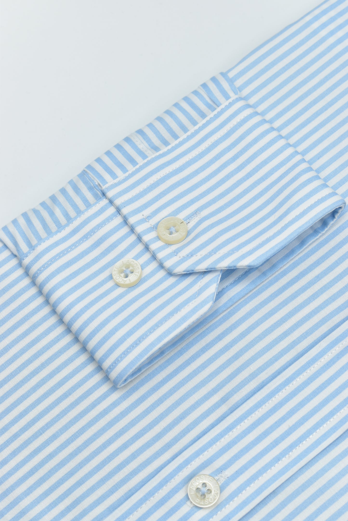 CAMISA MANGA LARGA LACOSTE (LAC) AZUL CLARO RAYAS BLANCAS